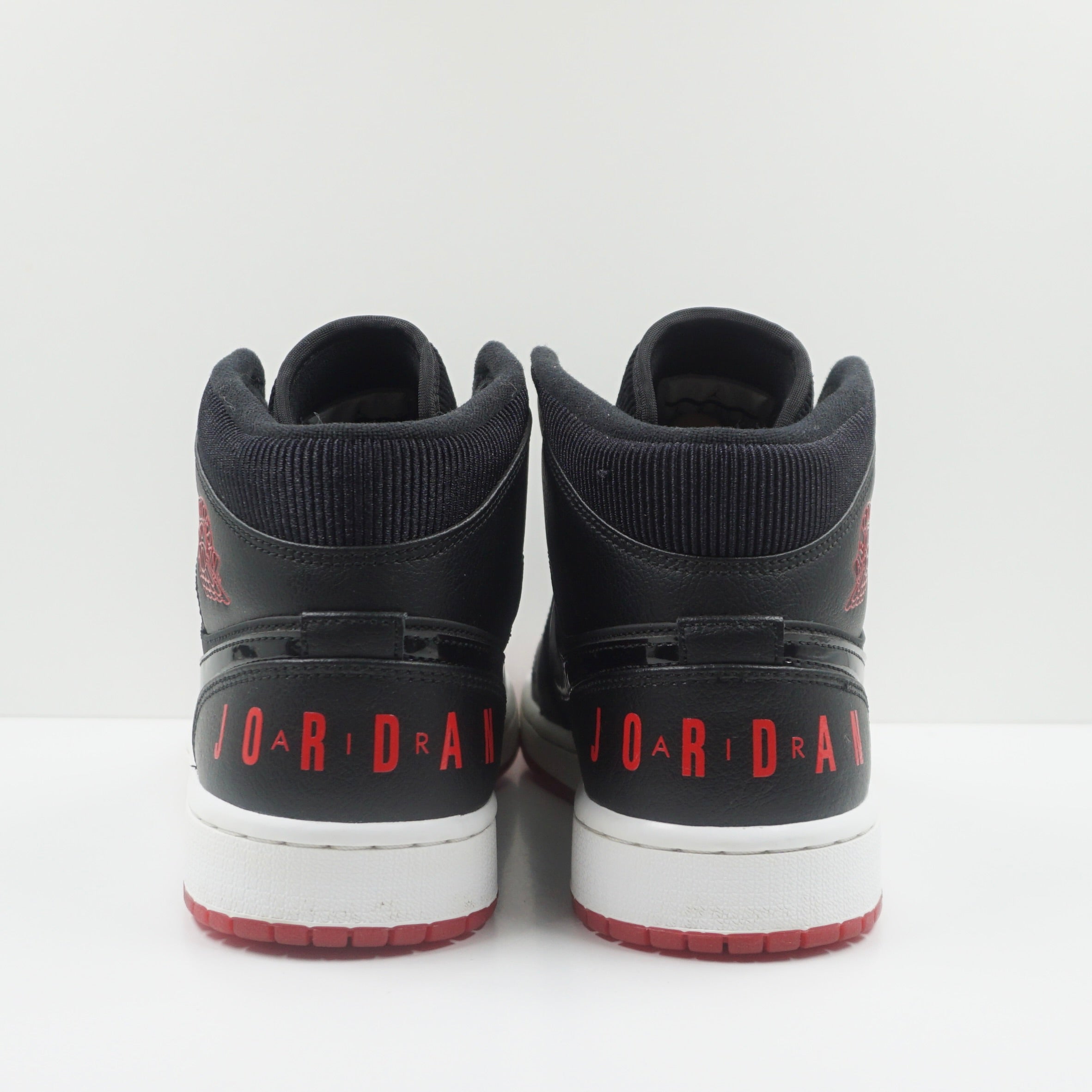 Jordan 1 Mid Black University Red