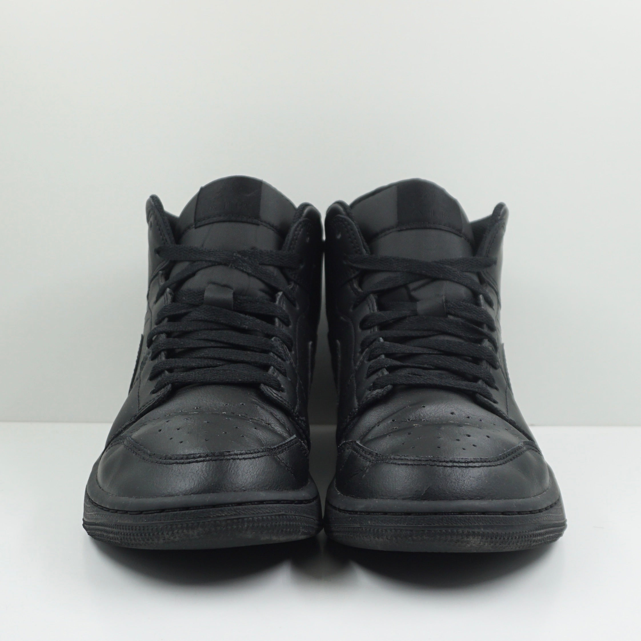 Jordan 1 Mid Triple Black