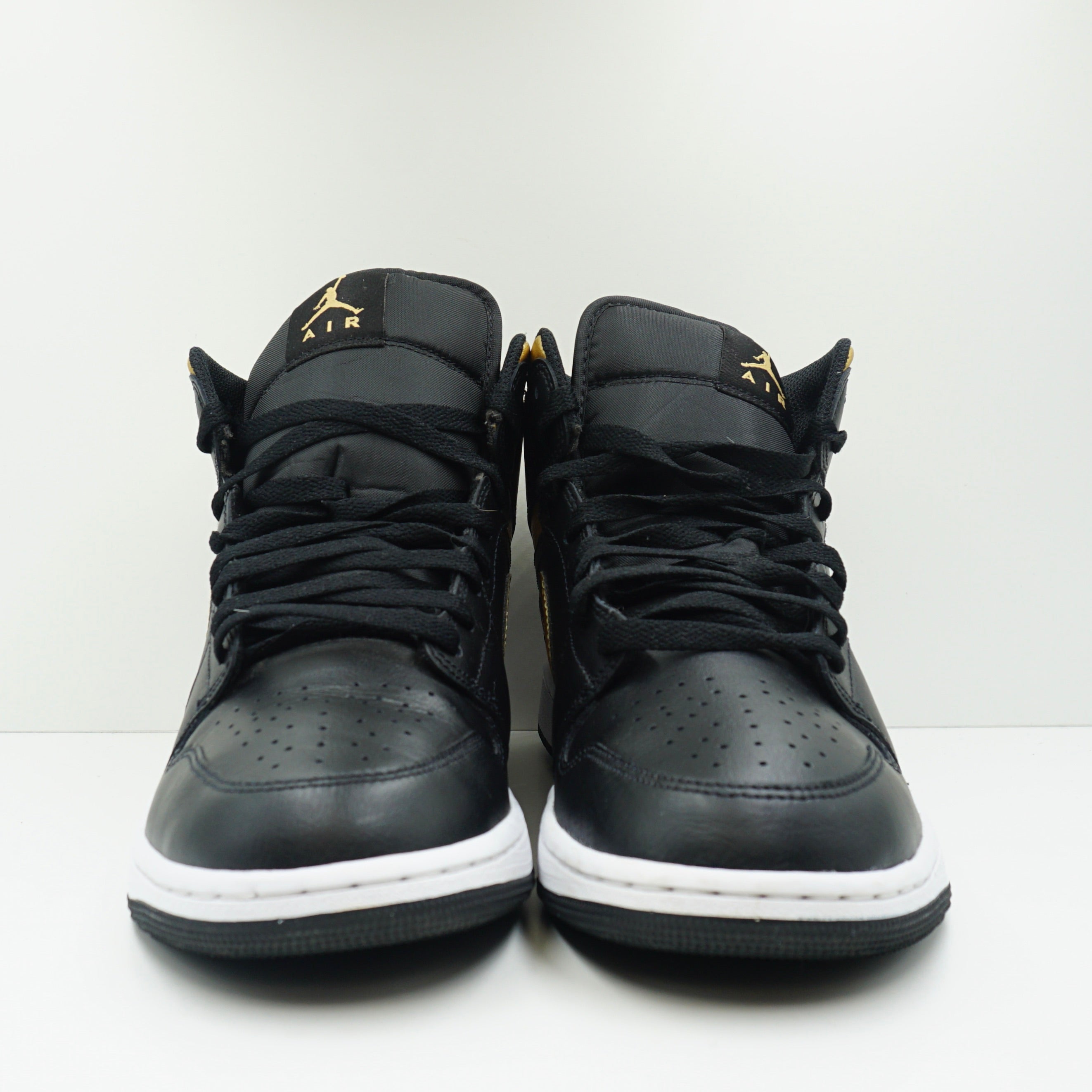 Jordan 1 Mid Black Metallic Gold