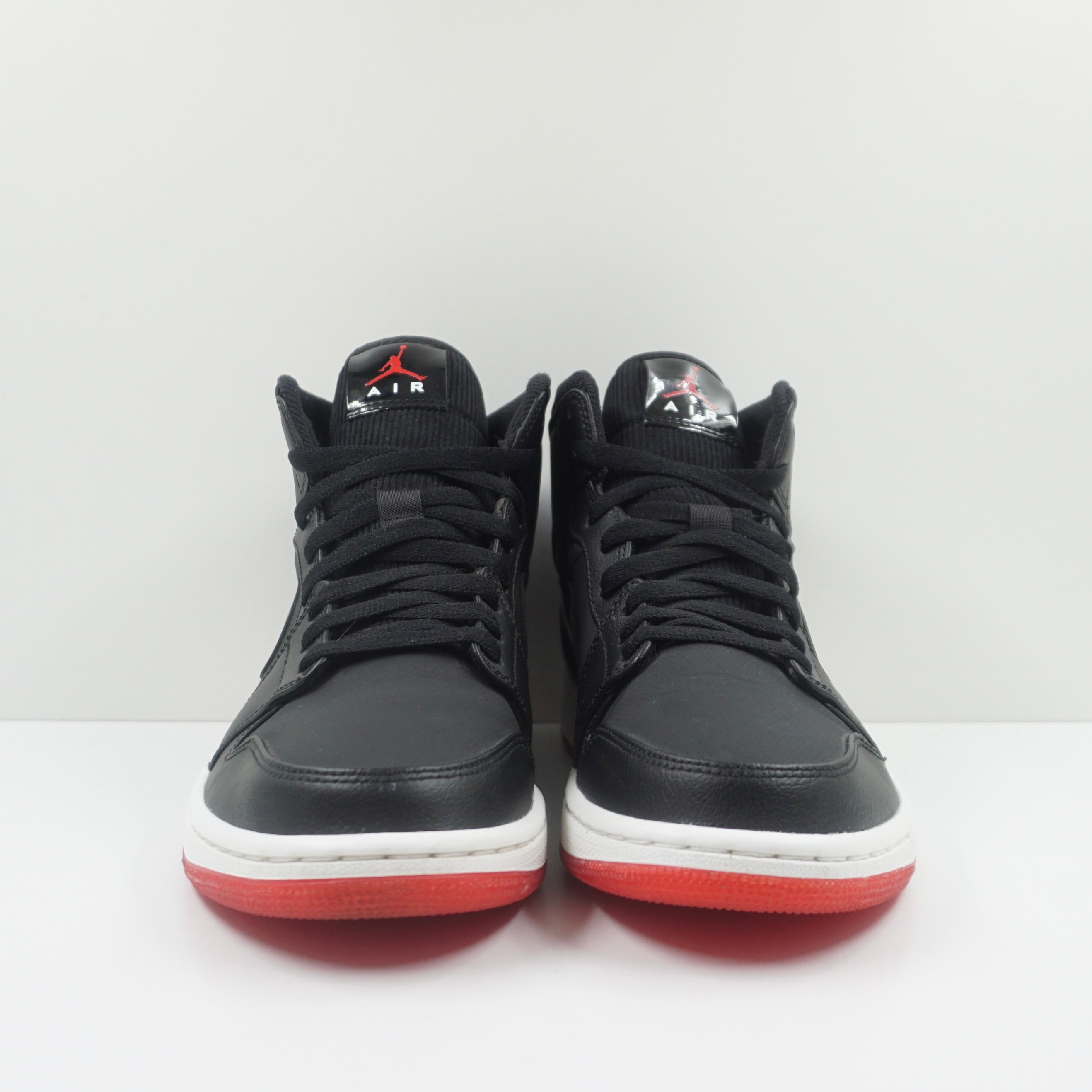 Jordan 1 Mid Black University Red