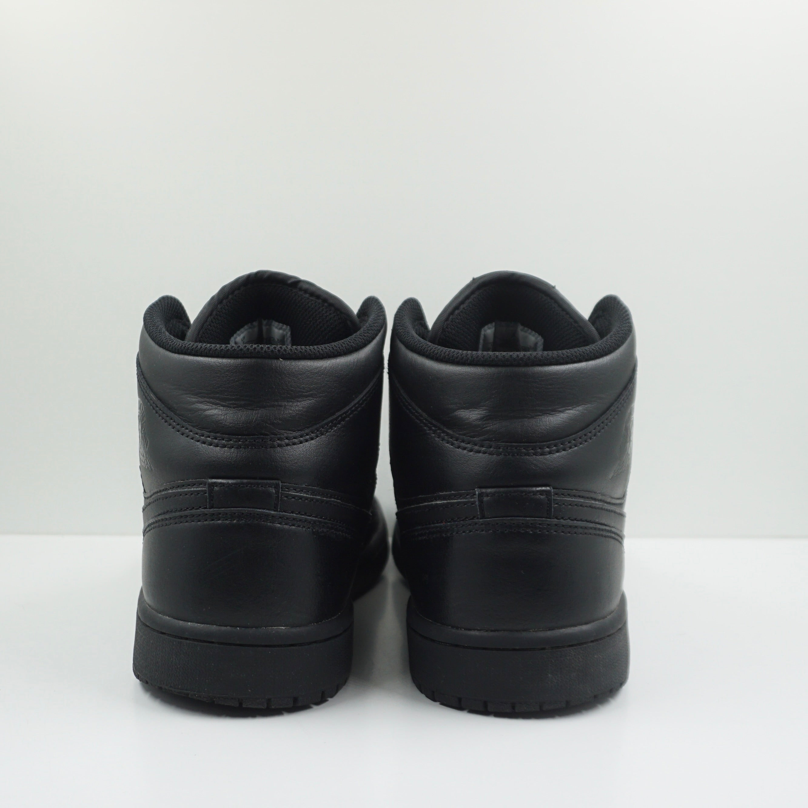 Jordan 1 Mid Triple Black