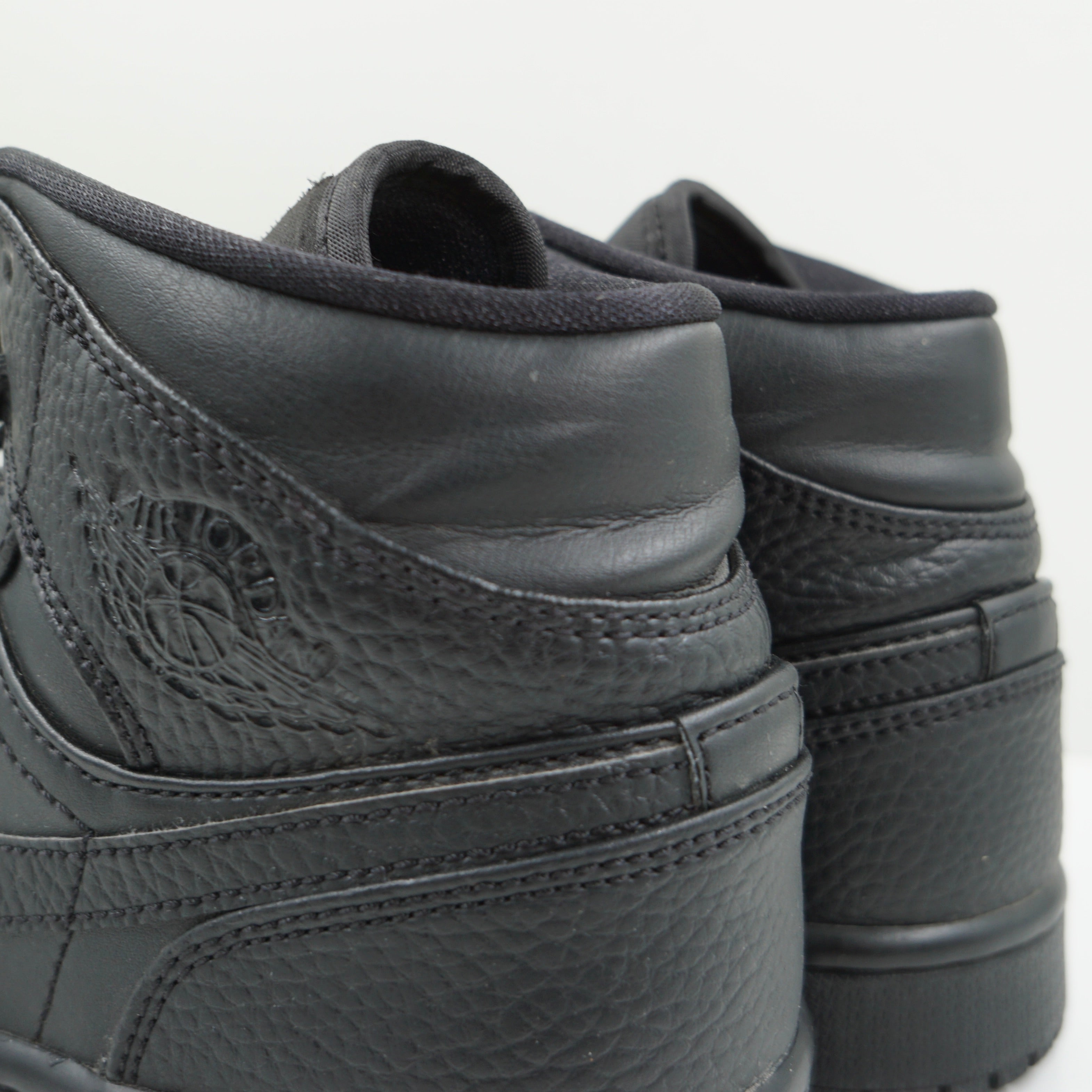 Jordan 1 Mid Triple Black