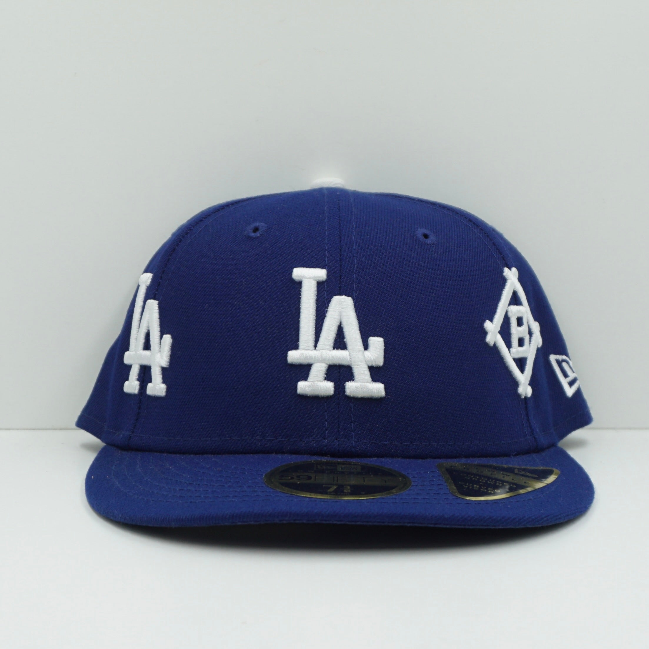 New Era Los Angeles Dodgers All Over Logo Dark Royal Blue Fitted Cap