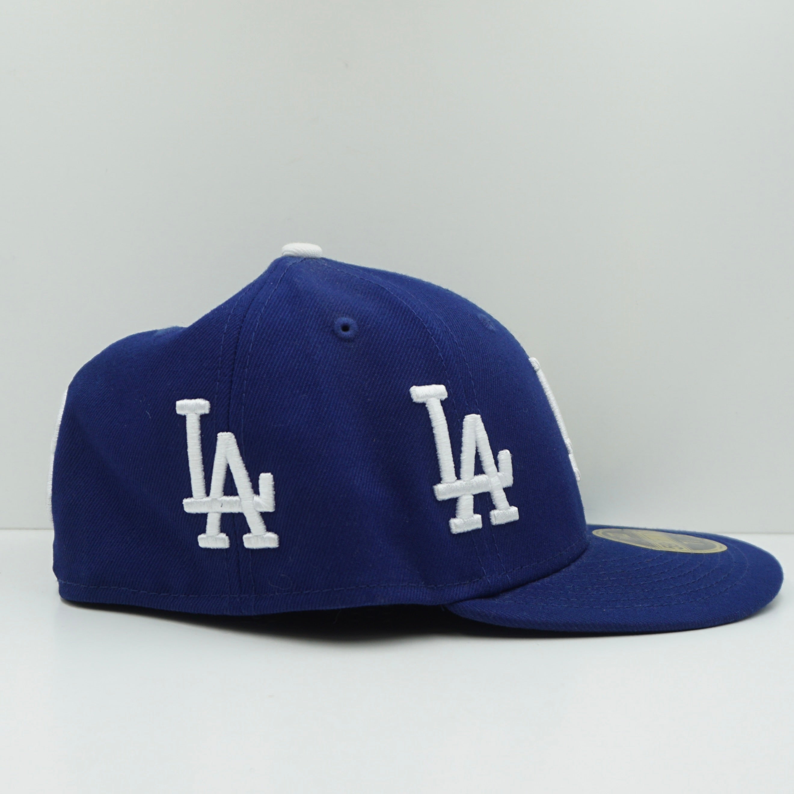 New Era Los Angeles Dodgers All Over Logo Dark Royal Blue Fitted Cap