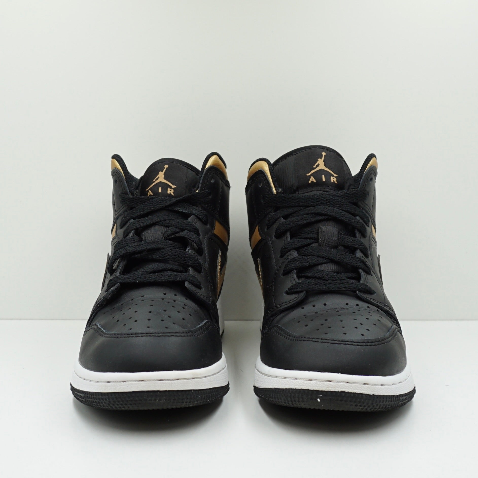 Jordan 1 Mid Black Metallic Gold Swoosh (GS)
