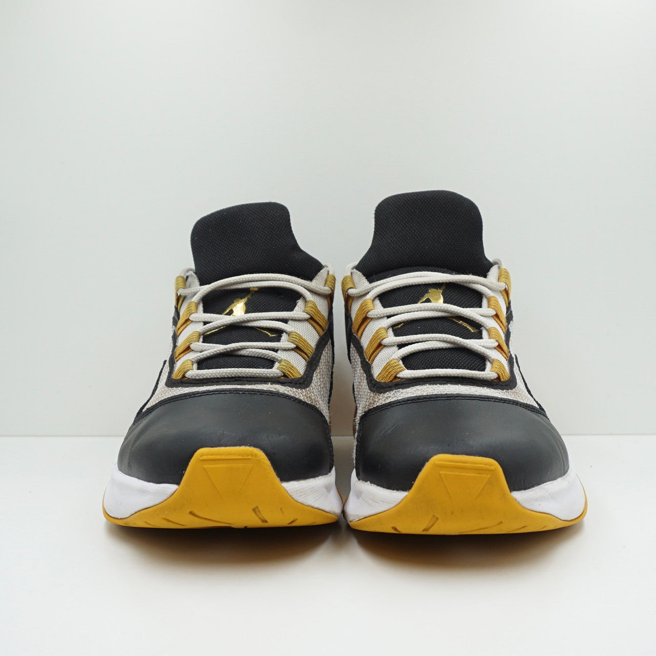 Jordan 11 CMFT Low Black Gold White
