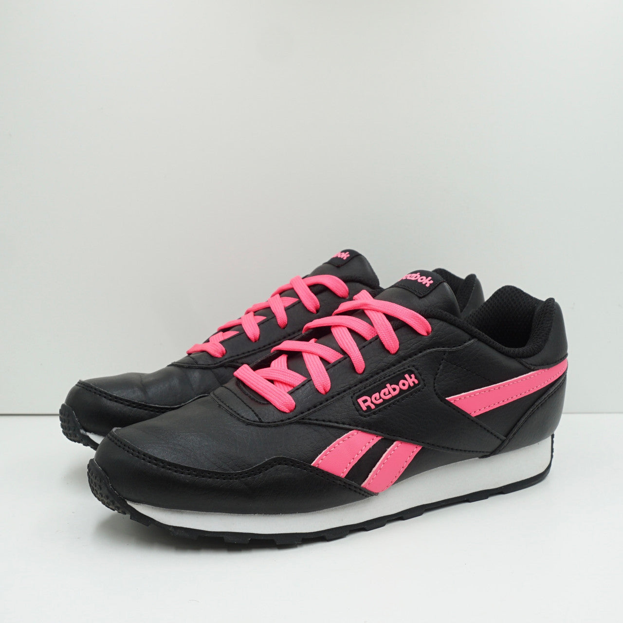 Reebok black store and pink trainers