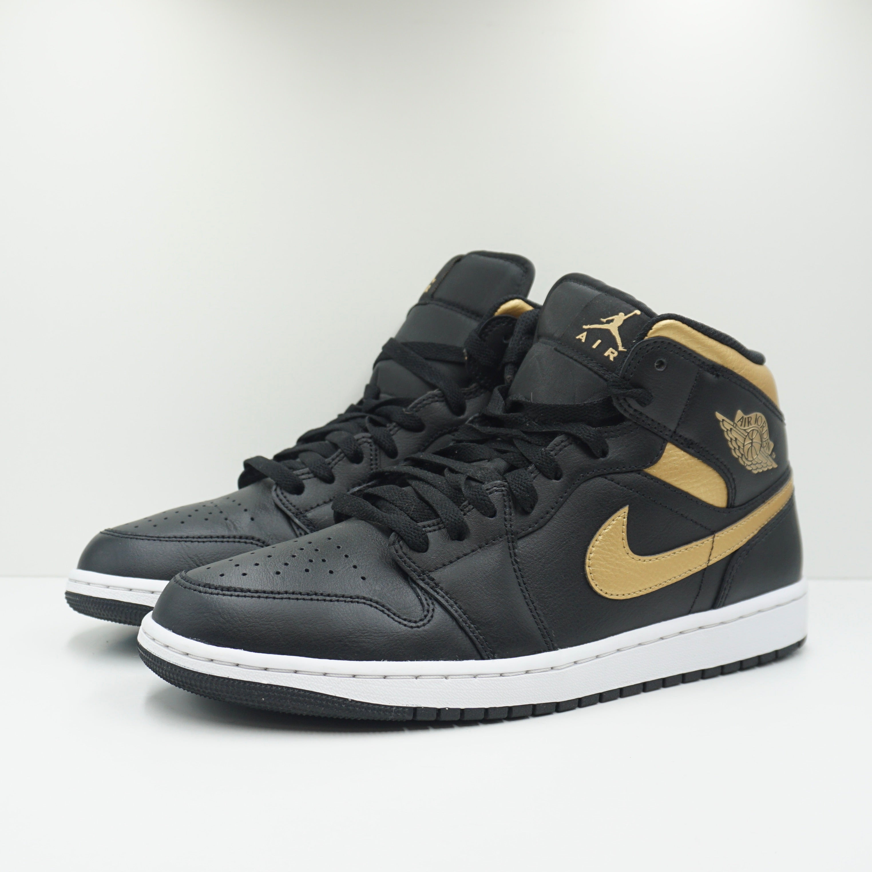 Jordan 1 Mid Black Metallic Gold