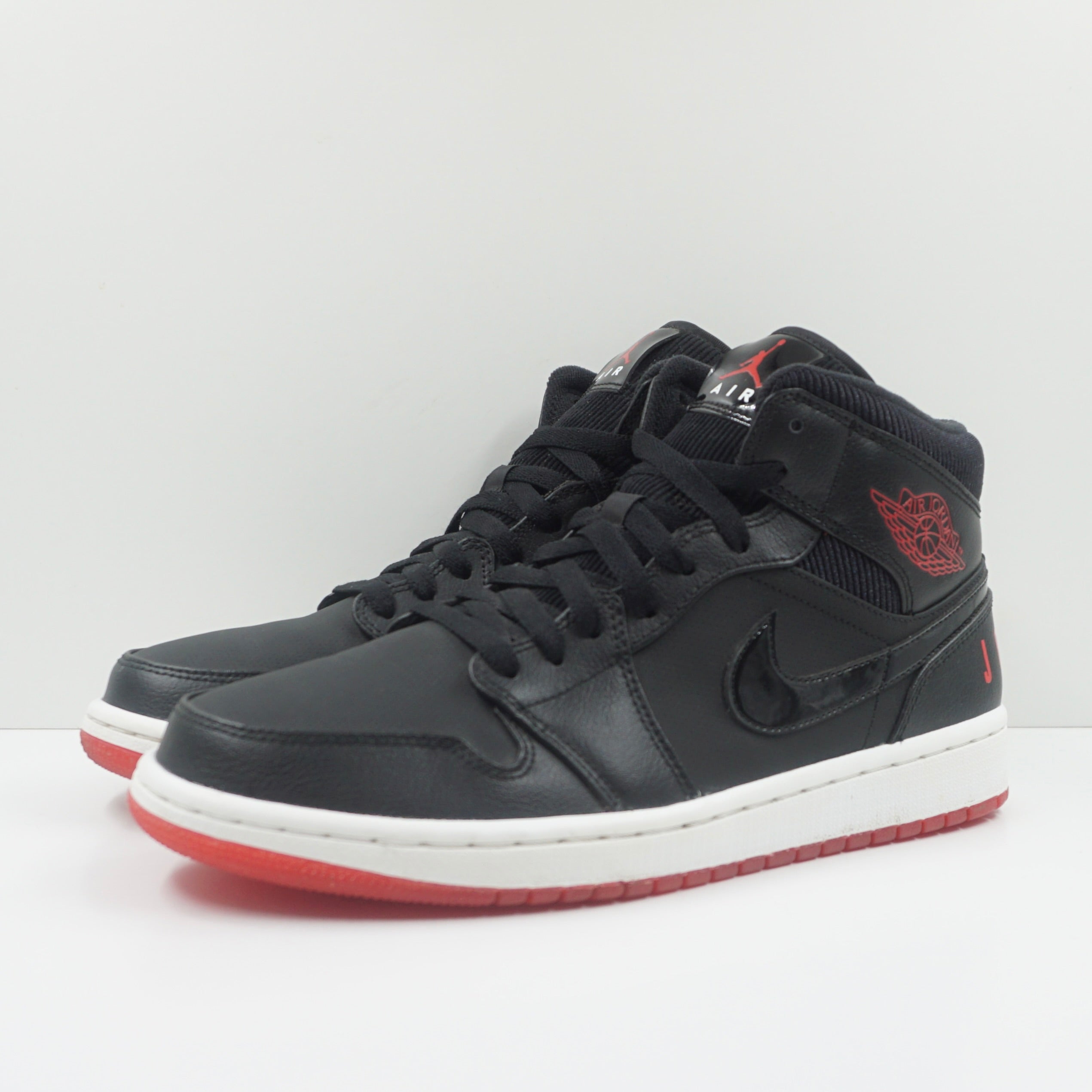 Jordan 1 Mid Black University Red