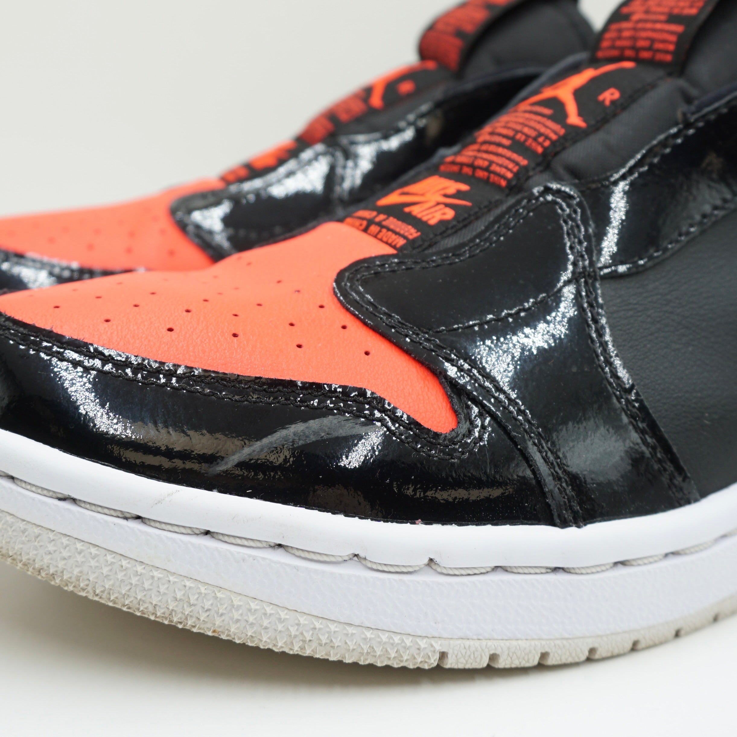 Jordan 1 Low Slip Black Hot Punch (W)