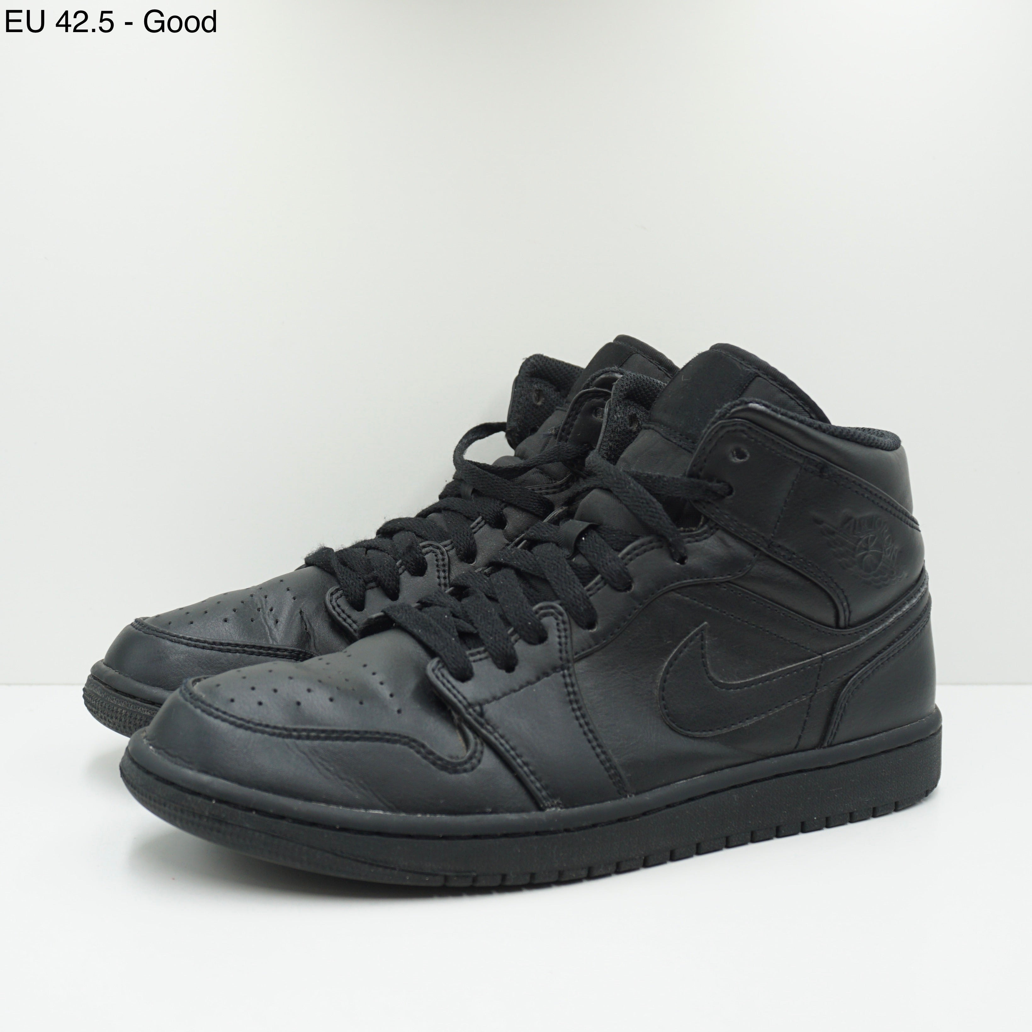 Jordan 1 Mid Triple Black