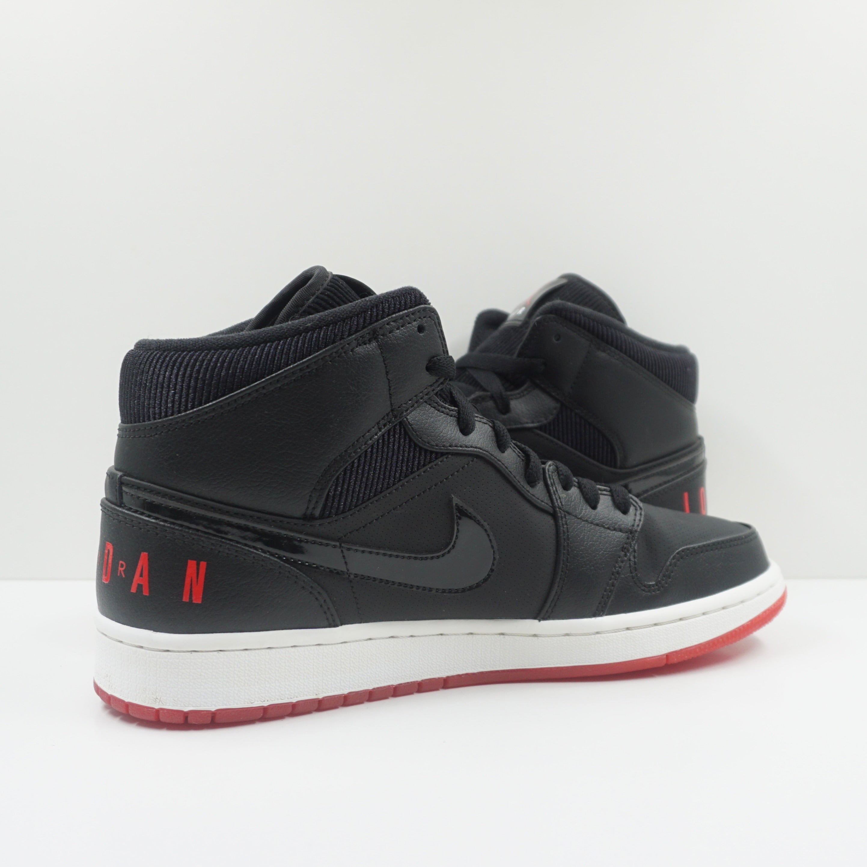 Jordan 1 Mid Black University Red