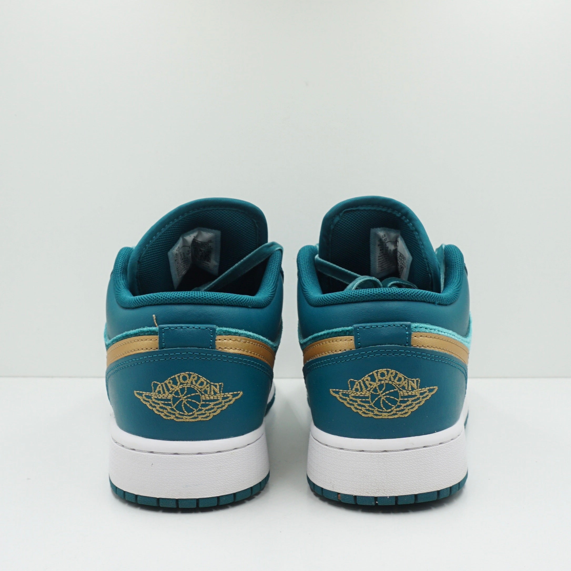 teal and gold jordans