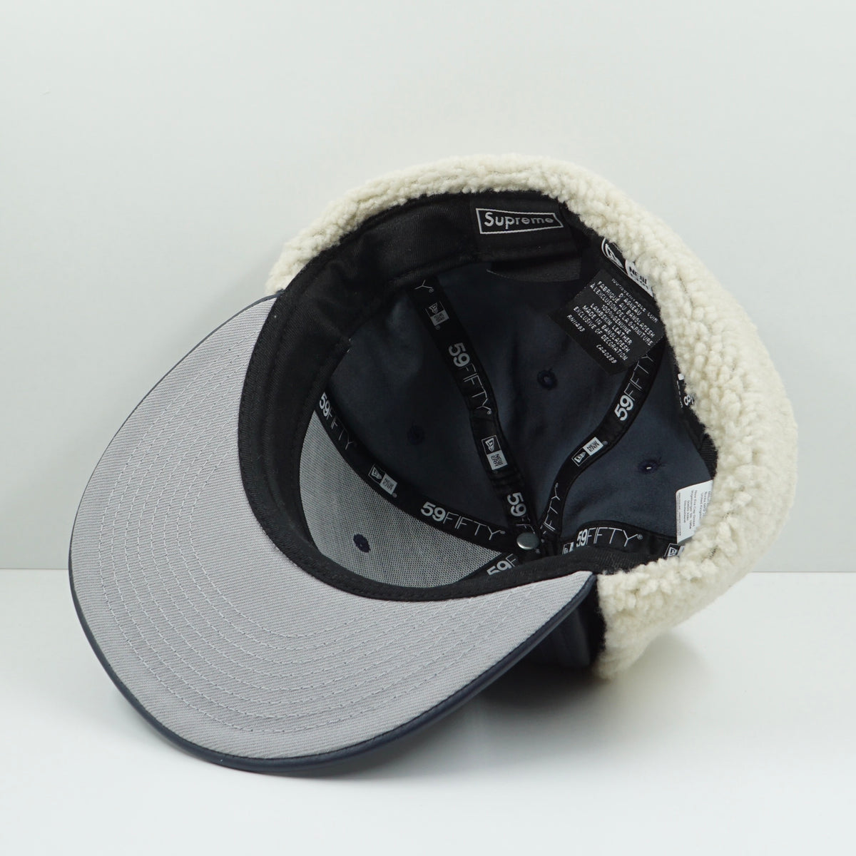 Supreme FW22 Leather Earflap Box Logo New Era Navy Fitted Cap