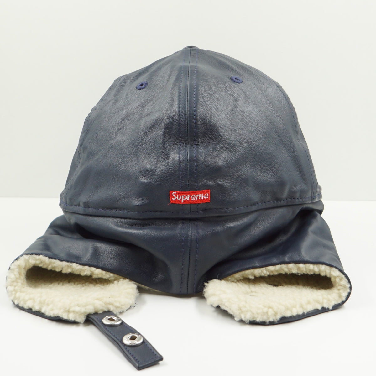 Supreme FW22 Leather Earflap Box Logo New Era Navy Fitted Cap