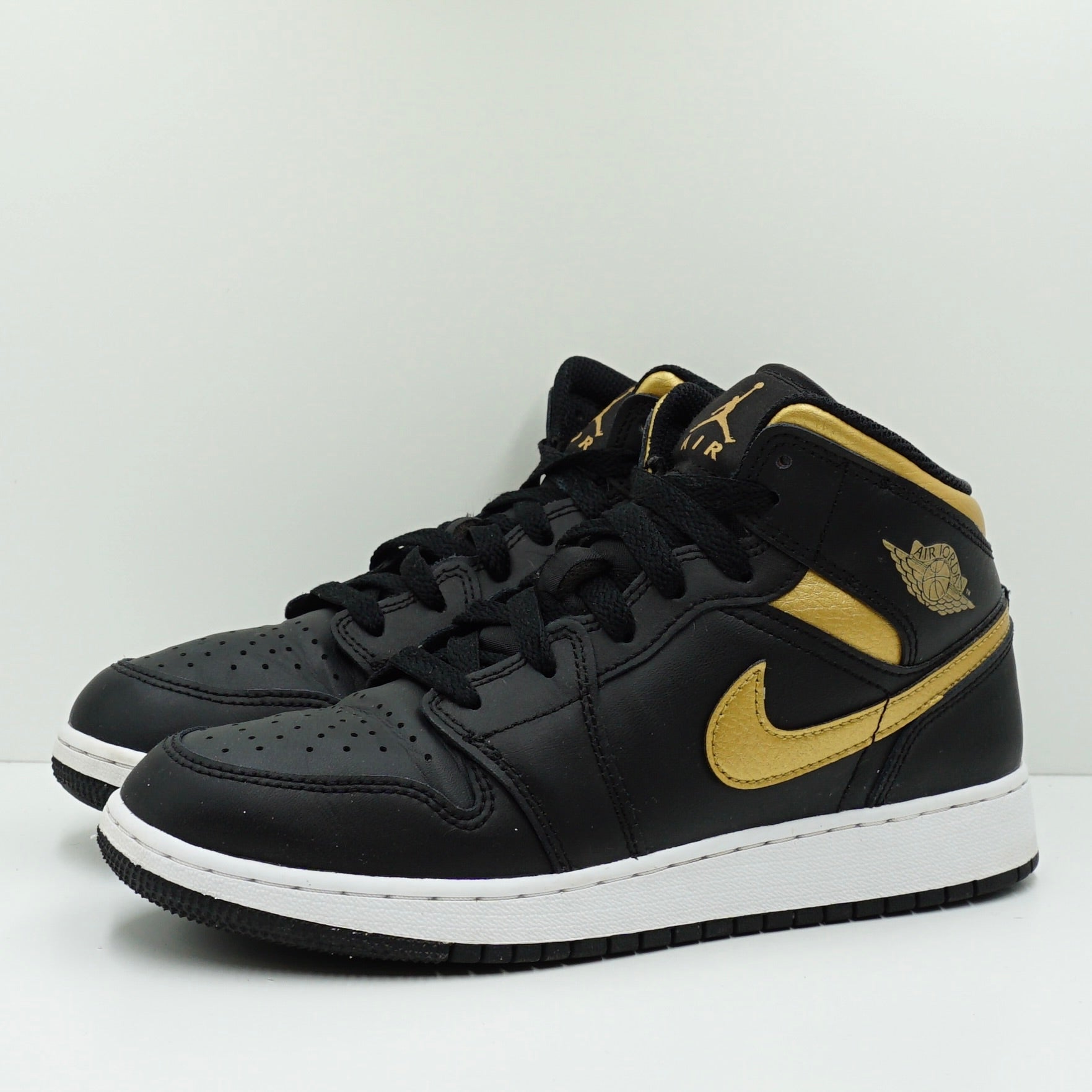 Jordan 1 Mid Black Metallic Gold Swoosh (GS)