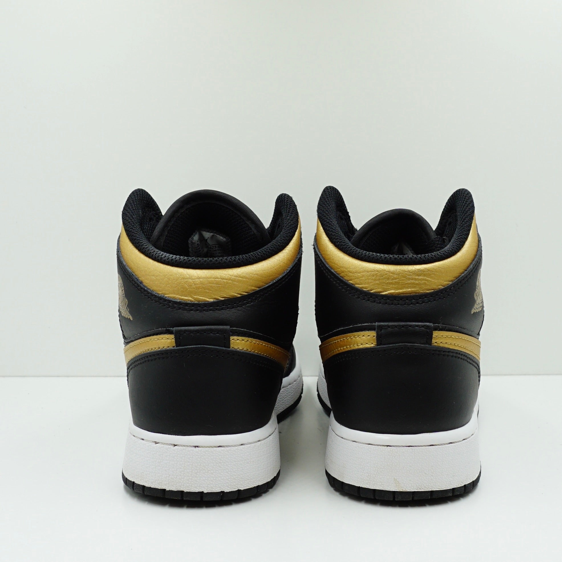 Jordan 1 Mid Black Metallic Gold Swoosh (GS)