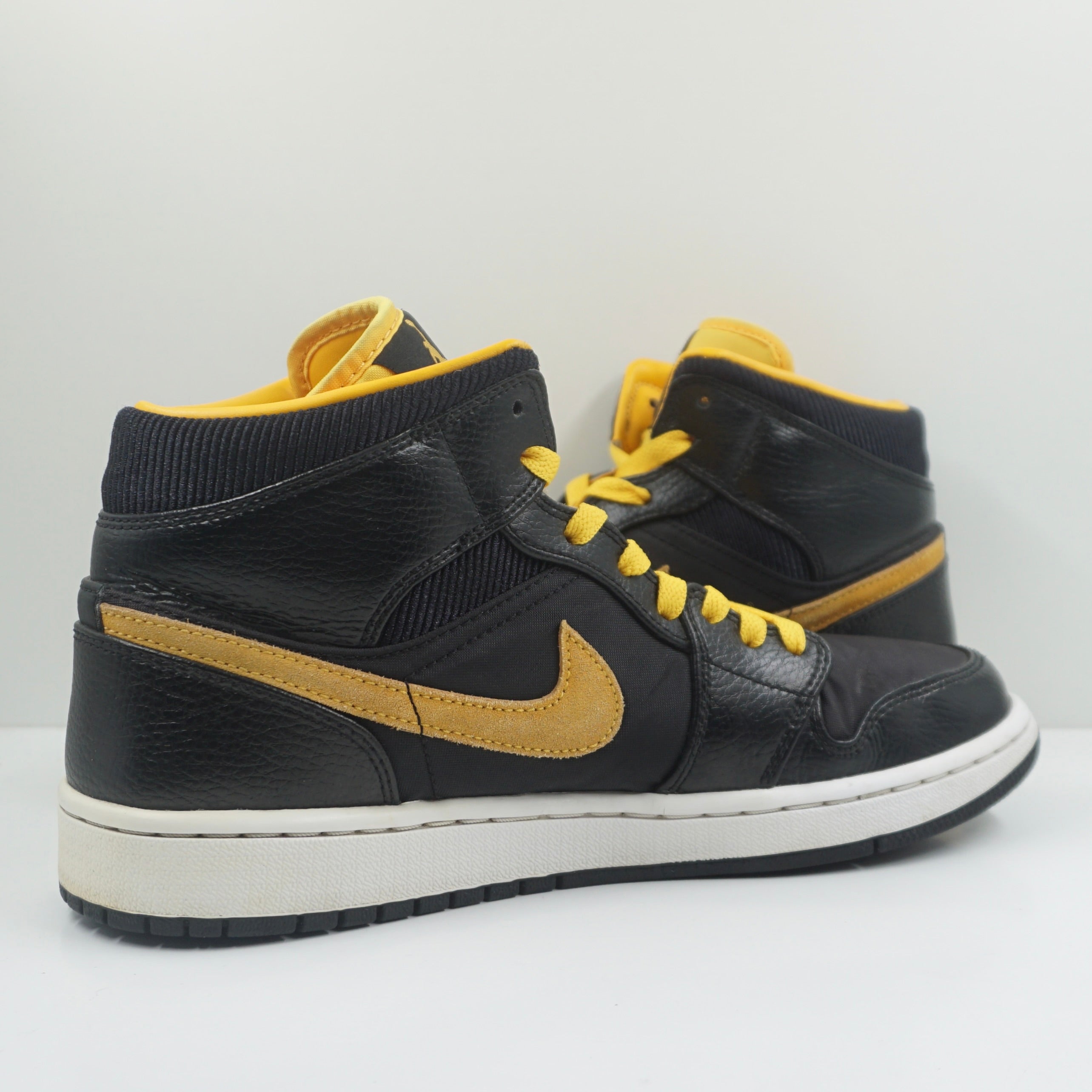 Jordan 1 Mid Black University Gold