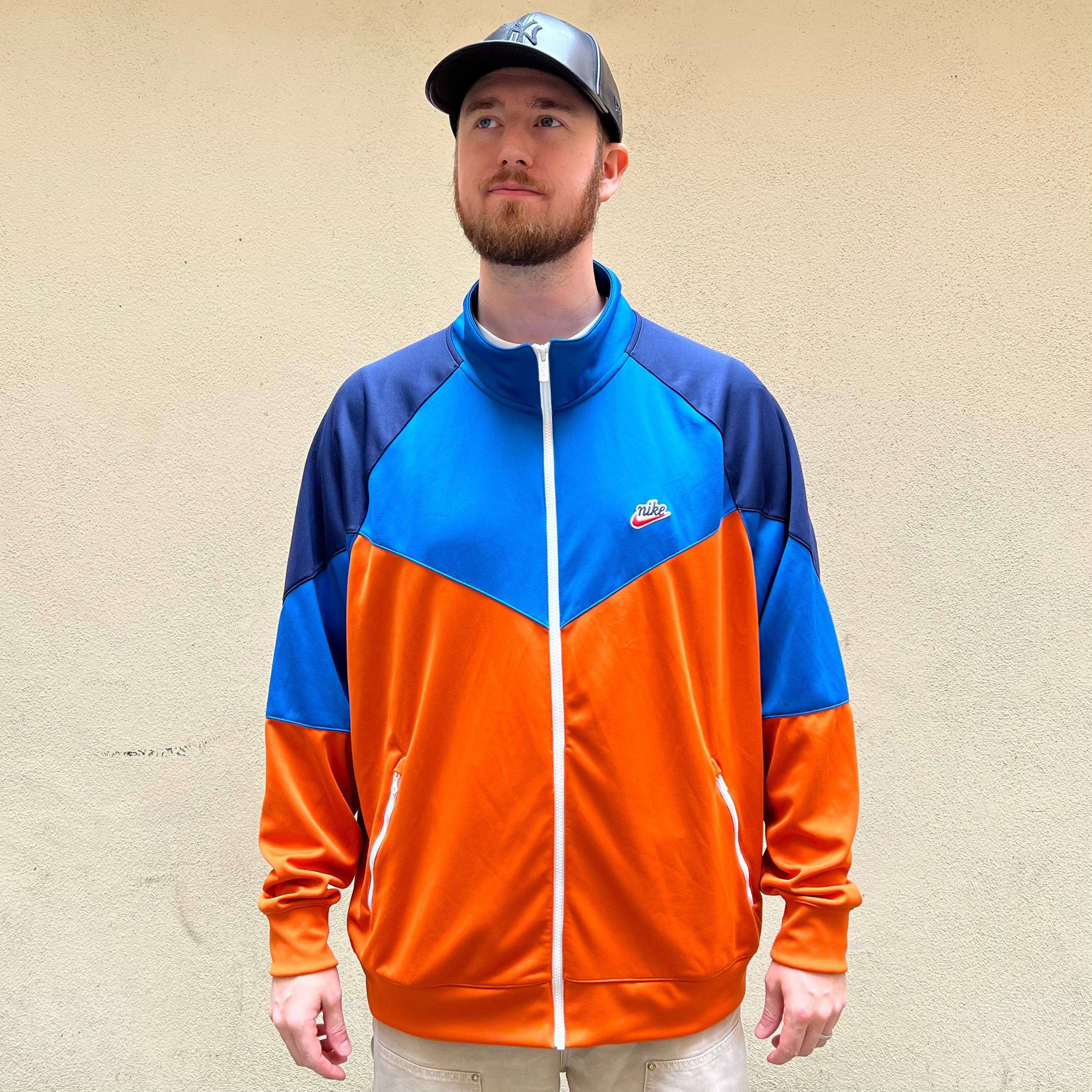 Nike blue track top sales