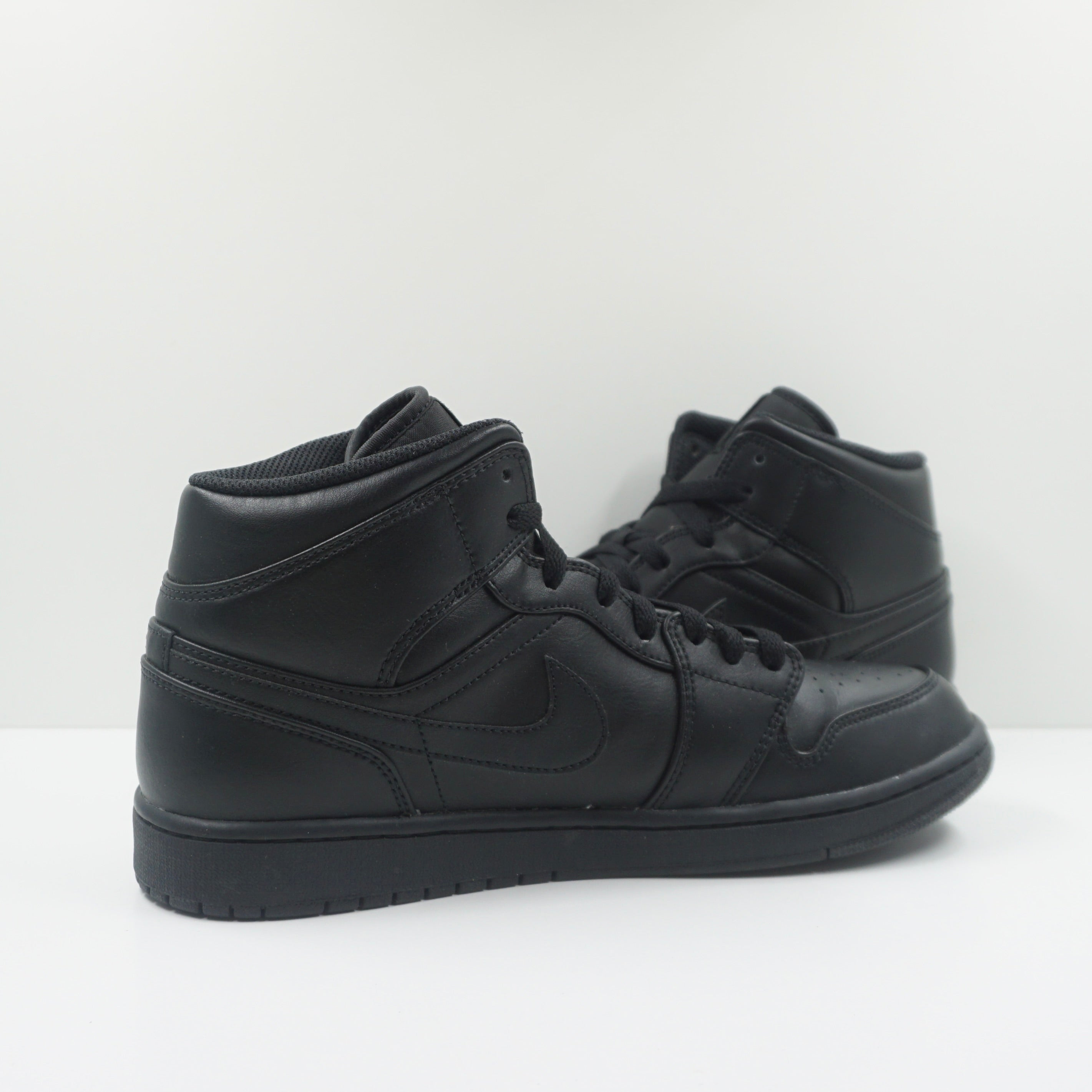 Jordan 1 Mid Triple Black