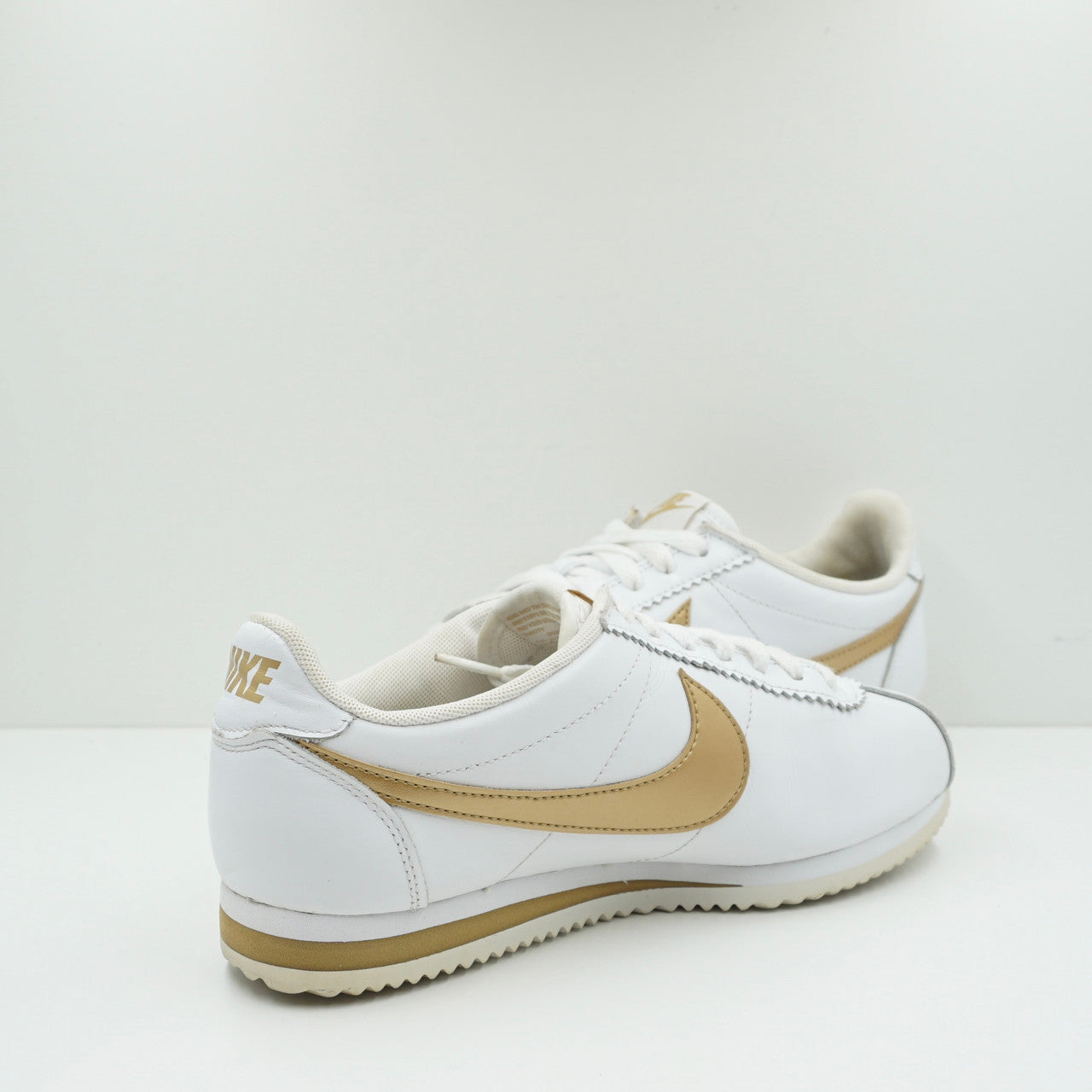 Nike cortez gold and clearance white